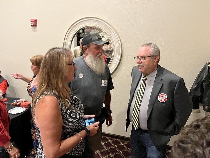 Steve Zipperman, Republican candidate for the Arizona Senate seat in Legislative District 1, right, talks with supporters Shirlee Miller, left, and Brian Mounsey, center, after primary results were announced Tuesday night, Aug. 2, 2022. (Cindy Barks/Courier)