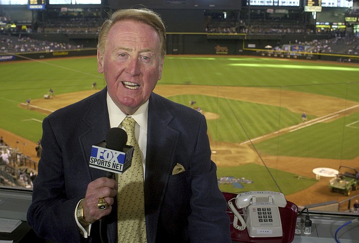 Vin Scully, the voice of the Los Angeles Dodgers for 67 years, died Tuesday at age 94. (AP file photo)