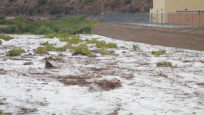 Mohave County public safety officials encourage residents to continue to monitor monsoon weather developments and National Weather Service warnings and be prepared for potentially life-threatening situations. A flooded wash is shown near Kingman on July 27.(Miner file photo)
