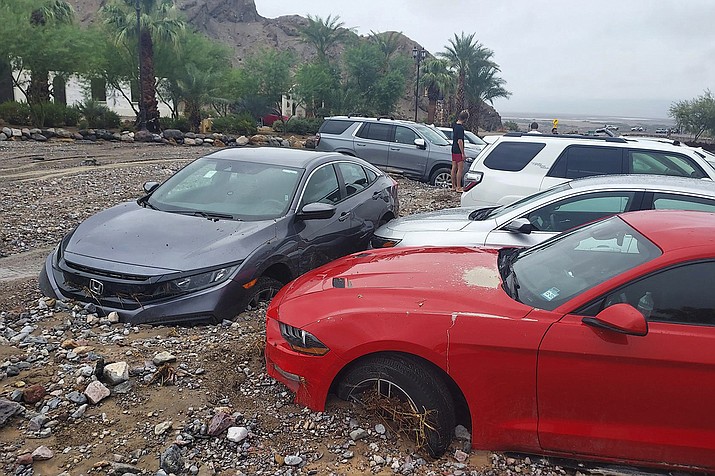 Cars at the Inn at Death Valley are immobilized by debris following rain storms. (Photo/NPS)