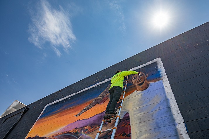 Artist and writer Isaac Caruso uses his public art to communicate with communities and help give them a visual identity. He is completing murals in Winslow as part of a book project to bring attention to ADHD. (Photos/Lori Bentley Law)