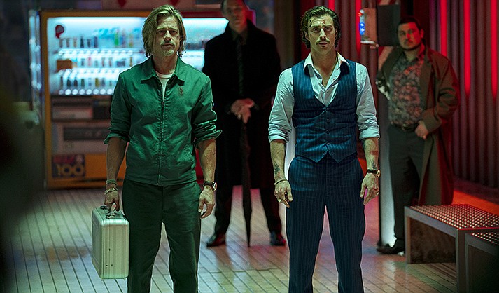 This image released by Sony Pictures shows Brad Pitt, left, and Aaron Taylor-Johnson in a scene from “Bullet Train.” (Scott Garfield/Sony Pictures via AP)