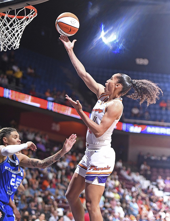 Phoenix Mercury guard Skylar Diggins-Smith (4) scores over Connecticut Sun guard Natisha Hiedeman (2) in WNBA action Tuesday, August 2, 2022 at Mohegan Sun Arena in Uncasville, Conn. (Sean D. Elliot/The Day via AP)