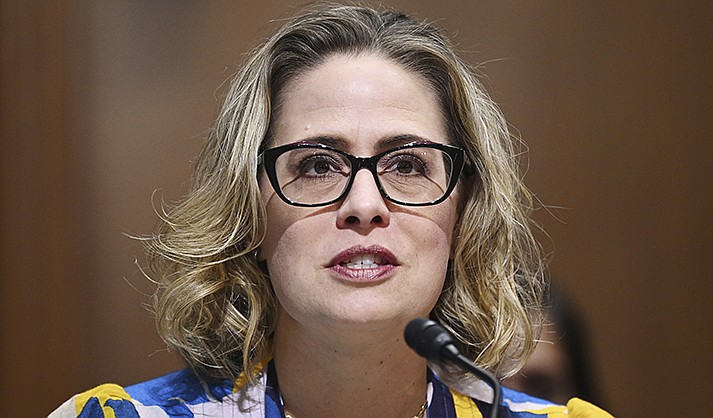 Sen. Kyrsten Sinema, D-Ariz., speaks during a Senate Finance Committee hearing Oct. 19, 2021 on Capitol Hill in Washington. Sinema received a $1 million surge of campaign cash over the past year from private equity professionals, hedge funds and venture capitalists whose interests she has staunchly defended in Congress. That's according to an Associated Press review of campaign finance disclosures.(Mandel Ngan/Pool via AP, File)