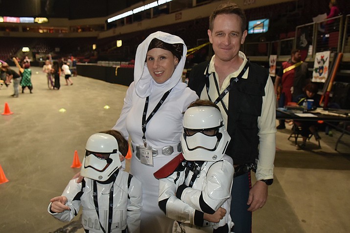 Jessica Ebel as Princess Leia, Josh Broadbent as Han Solo, with Elijah, 5, and Everett, 8, as storm troopers at Fandomania at the Findlay Toyota Center in Prescott Valley, Saturday, Aug. 13, 2022. (Jesse Bertel/Courier)