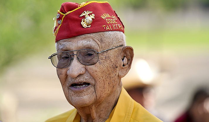 Navajo Code Talker Thomas Begay talks to people prior to the Arizona State Navajo Code Talkers Day celebration ceremony, Sunday, Aug. 14, 2022, in Phoenix. (AP Photo/Ross D. Franklin)