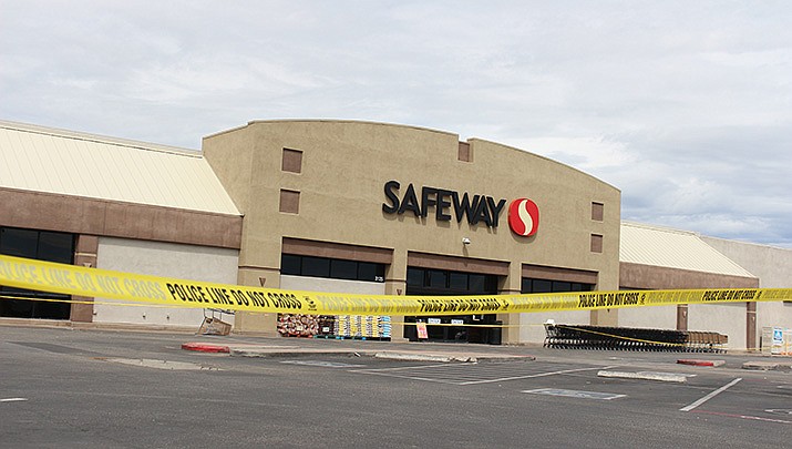 The parking lot at the Safeway grocery store in Kingman is surrounded by police tape after the building experienced a partial roof collapse on Saturday, Aug. 13. (Photo by MacKenzie Dexter/Kingman Miner)