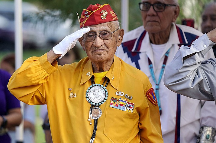 Navajo Code Talker Thomas Begay salutes during the national anthem at the Arizona State Navajo Code Talkers Day celebration Aug. 14 in Phoenix. (AP Photo/Ross D. Franklin)