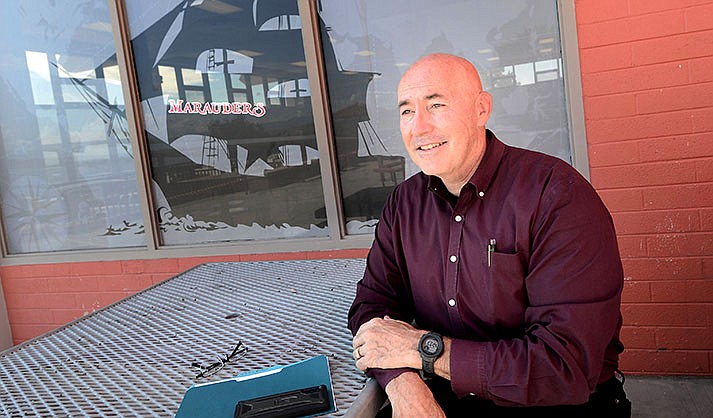 Mingus High School Superintendent Mike Westcott talks about a plan for a new capital bond in 2023 in front of Mingus’s Marauder new window graphics in the school’s external windows that help with cooling.  (VVN/Vyto Starinskas)