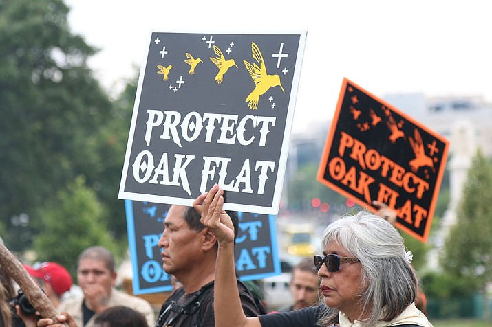 Protests against the Resolution Copper mine near Oak Flat have been going for years, as shown in this 2015 file photo from a rally at the Capitol. Opponents say the mine will harm the environment and sacred sites, supporters say those issues have been dealt with and the mine will bring jobs and economic development. Few expect the fight to end soon. (Photo by Jamie Cochran/Cronkite News)