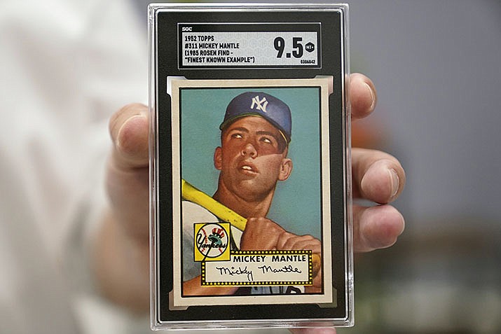 A Mickey Mantle baseball card is displayed at Heritage Auctions in Dallas, on July 21, 2022. A mint condition Mickey Mantle baseball card has sold for $12.6 million, blasting into the record books Sunday, Aug. 28, 2022, as the most expensive ever paid for a piece of sports memorabilia. (LM Otero/AP, File)