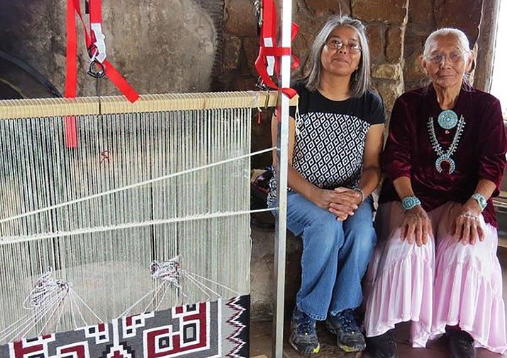 Diné artists, Louise Nez and Laverine Greyeyes demonstrate their rug weaving at Desertview Watchtower at Grand Canyon National Park Aug. 25-26. (Photo/NPS)