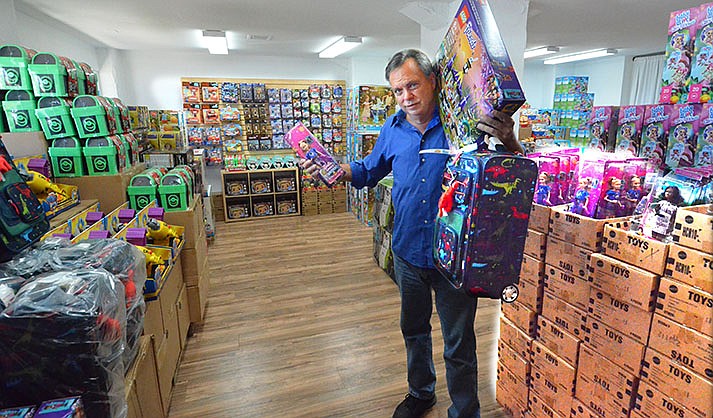 Joe Hook shows off his stock including Barbie and other brand names. VVN/Vyto Starinskas