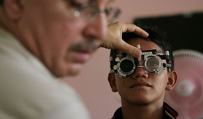 Optometric care is one of the services – with chiropractic, podiatric and dental care – that a group of local health care centers say Arizona’s Medicaid agency has not reimbursed them for. They claim the law requires the services be covered. (Photo by Leonardo Munoz/EPA/Shutterstock)