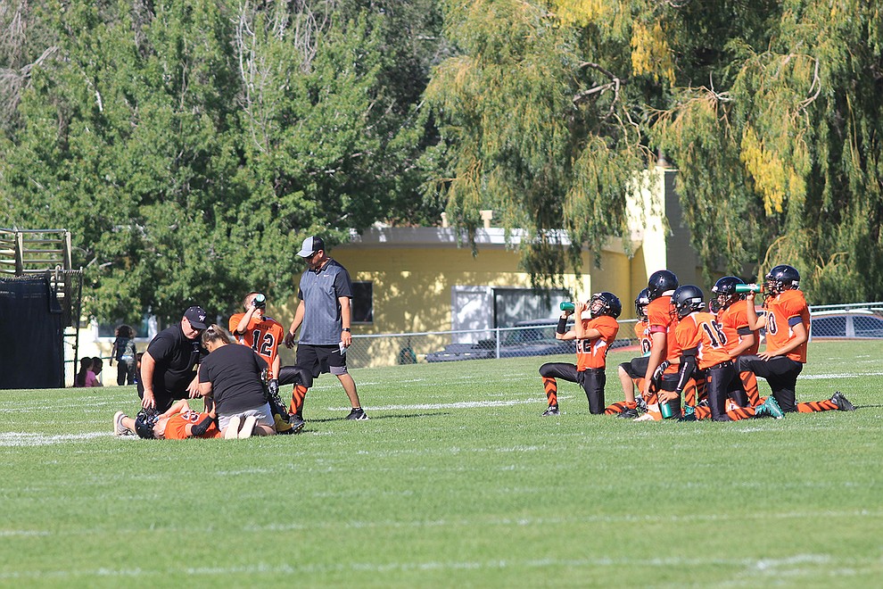 WEMS Falcons kneel for their teammate. (Photo/Abbigaile Urioste)