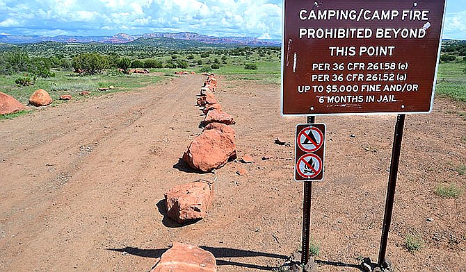 Large boulders and signs have confined campers in the long-awaited designated camping reorganization by the U.S. Forest Service — Coconino National Forest. (VVN/Vyto Starinskas)