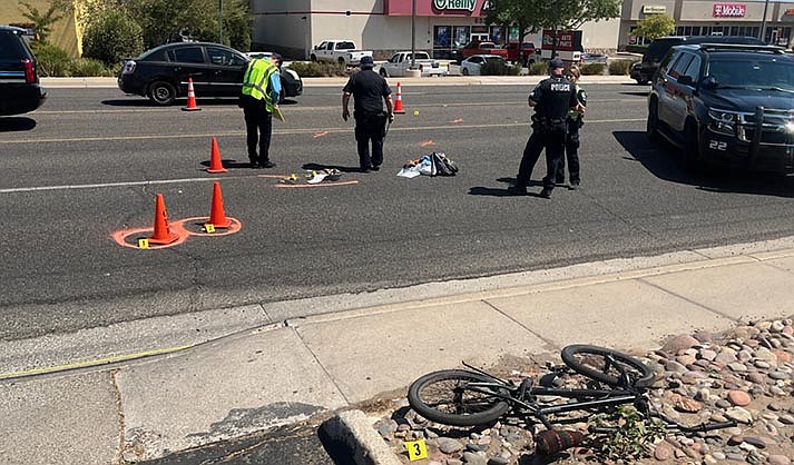Police investigate the scene of a bicycle/vehicle collision on Main Street in Cottonwood Sept. 7, 2022. (VVN/Vyto Starinskas)