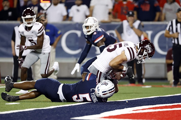 Mississippi State wide receiver Austin Williams (85) scores a touchdown while being tackled by Arizona safety Christian Young in the second half during a game Saturday, Sept. 10, 2022, in Tucson. (Chris Coduto/AP)