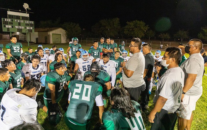 Window Rock Fighting Scouts players joined in the after game huddle with the Tuba City High School Warriors. (Photos/Gilbert Honanie)