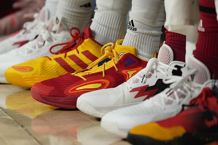 Basketball sneakers are seen at a game, Tuesday, March 29, 2022, in Chicago. Buy now, pay later loans allow users to pay for items such as new sneakers, electronics or luxury goods in installments. (Charles Rex Arbogast, AP File)