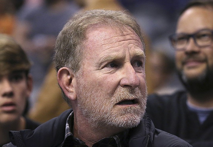 Phoenix Suns owner Robert Sarver watches the team play against the Memphis Grizzlies during the second half of an NBA basketball game in Phoenix, Dec. 11, 2019. The NBA has suspended Phoenix Suns and Phoenix Mercury owner Robert Sarver for one year, plus fined him $10 million, after an investigation found that he had engaged in what the league called “workplace misconduct and organizational deficiencies." PayPal said Friday the company will no longer sponsor the Suns if  Sarver remains part of the franchise when his suspension ends. (Ross D. Franklin, AP File)