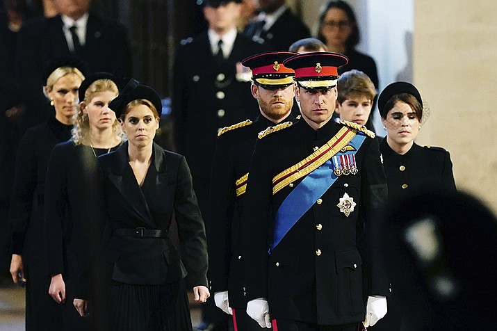 Left to right: Zara Tindall, Lady Louise, Princess Beatrice, Prince William, the prince of Wales, Prince Harry, Princess Eugenie, Viscount James Severn and Peter Phillips attend the vigil of the Queen's grandchildren around the coffin, as it lies in state on the catafalque in Westminster Hall, at the Palace of Westminster, London, Saturday, Sept. 17, 2022, ahead of her funeral on Monday. (Aaron Chown/Pool Photo via AP)