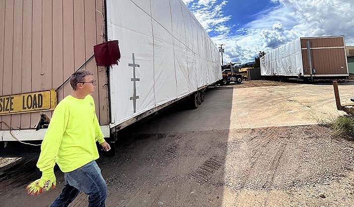 Workers were busy moving in a modular building on Tuesday, Sept. 15, 2022, for new administrate offices at Habitat for Humanity in Cottonwood. (VVN/Vyto Starinskas)