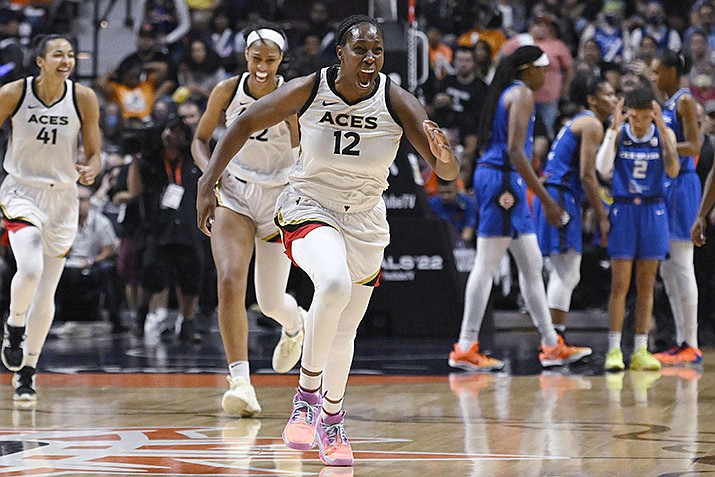 Las Vegas Aces' Chelsea Gray (12) celebrates with her team their win in the WNBA basketball finals against the Connecticut Sun, Sunday, Sept. 18, 2022, in Uncasville, Conn. (Jessica Hill/AP)