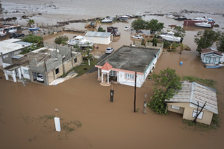 Homes are flooded on Salinas Beach after the passing of Hurricane Fiona in Salinas, Puerto Rico, Monday, Sept. 19, 2022. (Alejandro Granadillo/AP)