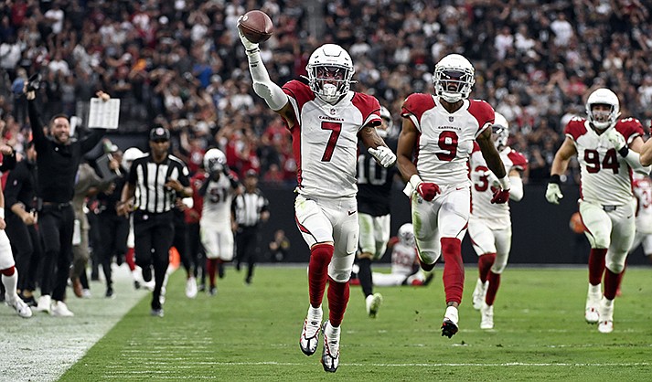 Arizona Cardinals cornerback Byron Murphy Jr. (7), a Saguaro High School graduate, runs back for the winning touchdown after a fumble recovery during overtime of an NFL football game against the Las Vegas Raiders, Sunday, Sept. 18, 2022, in Las Vegas. (AP Photo/David Becker)