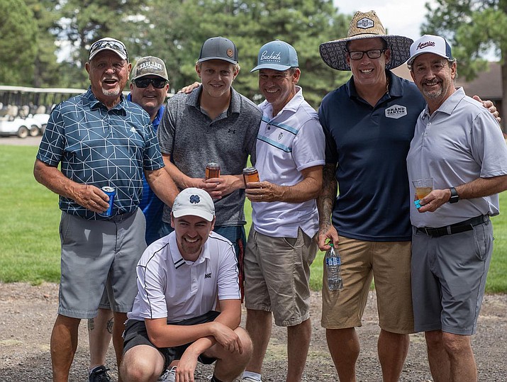 Community golfers join Grand Canyon Brewing Company CEO John Peasley (second from right) at the annual Putts and Pints event at Elephant Rocks Golf Course Sept. 7. The event raised $10,000 for Williams High School athletics.  (Photo/GC Brewery)