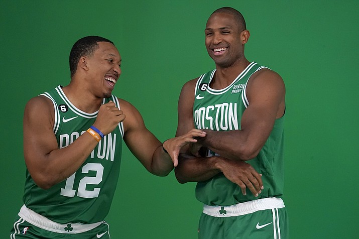 Boston Celtics forward Grant Williams, left, jokes with center Al Horford, right, as the players stand for photos during the team's Media Day, Monday, Sept. 26, 2022, in Canton, Mass. (Steven Senne/AP)