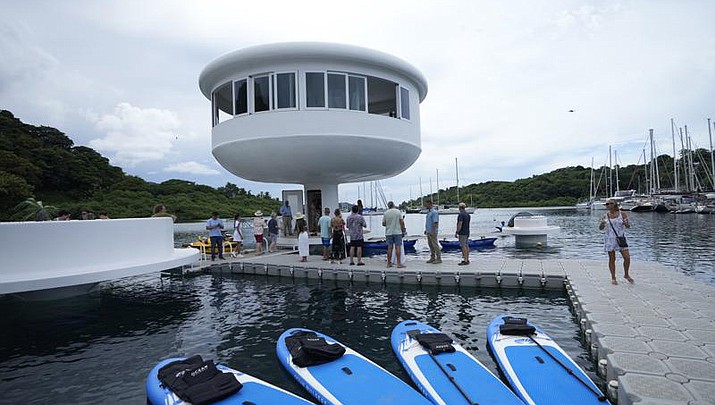 A SeaPod Eco prototype, the first of a futuristic line of homes built over water, is shown to the press in Linton Bay Marina, Panama, Thursday, Sept. 29, 2022. Developers hoped to market these homes that are only accessible by boat off Panama's Caribbean coast but the prototype partially collapsed after its first showing to the press. (Arnulfo Franco/AP)