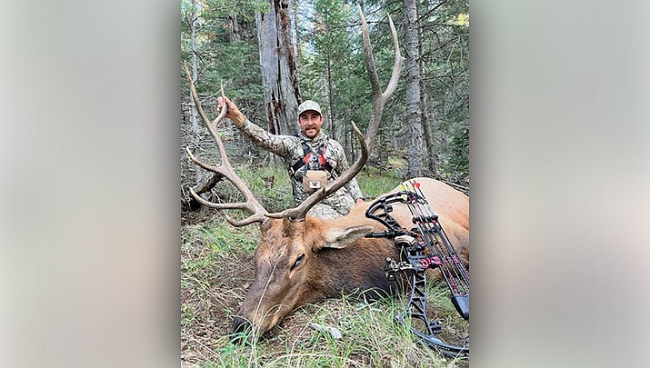 Jimmy Herrero displays the 6X5 bull elk he bagged with a bow near Flagstaff this fall. (Courtesy photo)