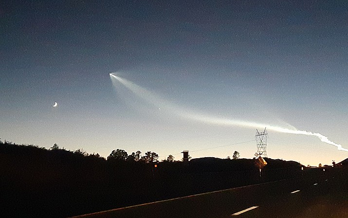 A SpaceX rocket was visible in the western sky from Prescott, Arizona, at about 6:20 p.m. Thursday, Oct. 27, 2022, and its trail was illuminated by the setting sun - viewed from Pioneer Parkway in north Prescott. (Tim Wiederaenders/Courier)