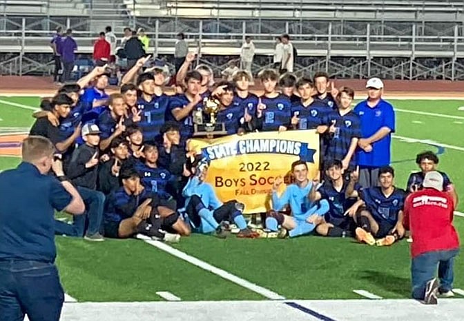 Chino Valley boys soccer holds up their state title banner after defeating Sedona Red Rock 3-1 in the 2A fall state championship game on Saturday, Oct. 29, 2022, at Westwood High School in Mesa. (CVUSD/Courtesy)