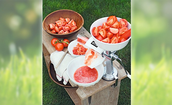 Tomato press and sauce makers turn garden-ripe tomatoes into a seed-free, skin-free sauce with the turn of a handle. (Gardener’s Supply Company/Courtesy)