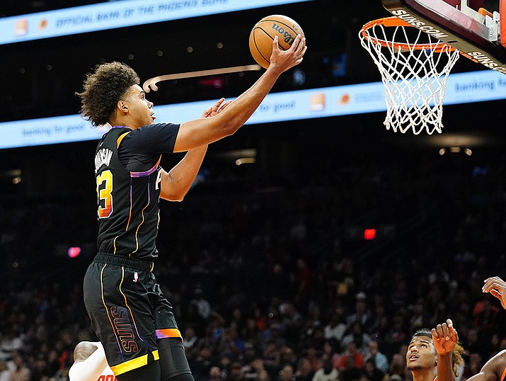 Phoenix Suns' Cameron Johnson goes to the basket (23) untouched by any Houston Rockets during the second half of an NBA basketball game, Sunday, Oct. 30, 2022, in Phoenix. (Darryl Webb/AP)