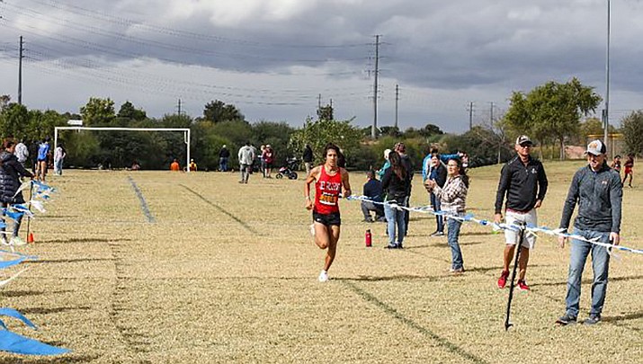 Lee Williams High School junior Wyatt Pickering crosses the finish line for a second-place finish at the Division III sectional cross-country championship Nov. 3 at Crossroads Park in Gilbert. (Courtesy photo)