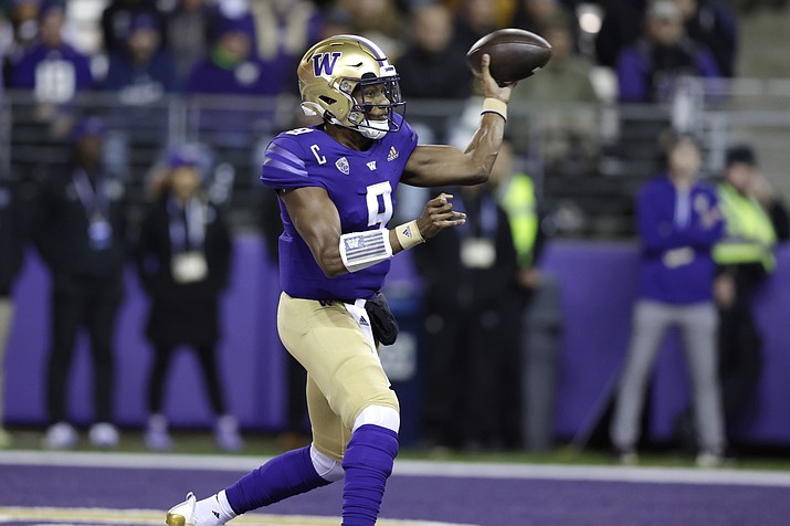 Washington quarterback Michael Penix Jr. throws a pass against Oregon State during the first half of a game Friday, Nov. 4, 2022, in Seattle. (John Froschauer/AP)