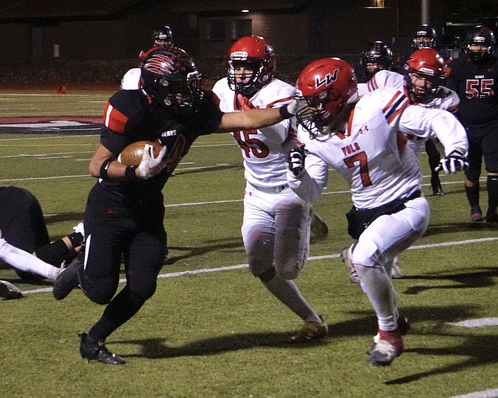 Bradshaw Mountain running back Gabriel Ricketts (44) runs the ball and stiff arms the Lee Williams defense during a game on Thursday, Nov. 10, 2022, at Bob Pavlich Field in Prescott Valley. (Aaron Valdez/Courier)
