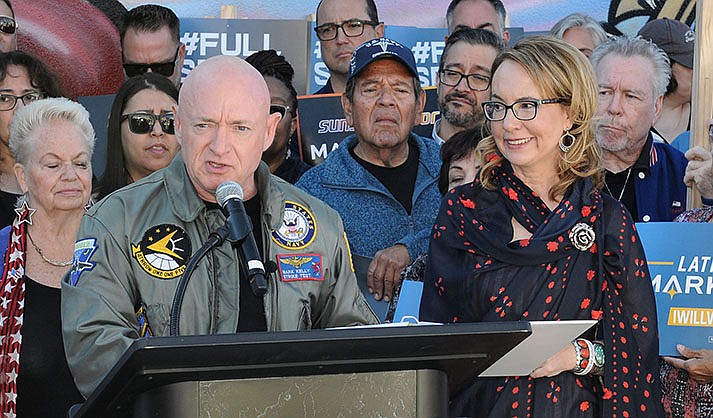Sen. Mark Kelly thanks supporters Saturday for electing him to a new six-year term during a victory speech with wife, former Congresswoman Gabrielle Giffords, at his side. (Capitol Media Services photo by Howard Fischer)