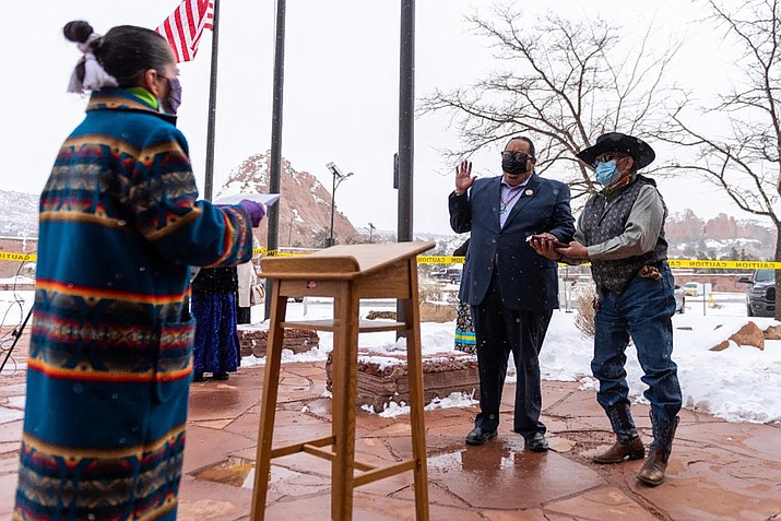 Seth Damon is sworn in for a second term on the Navajo Nation Council. Damon has stepped down as speaker following a controversial off-duty photo was published. (Photo/Indian Country Today)