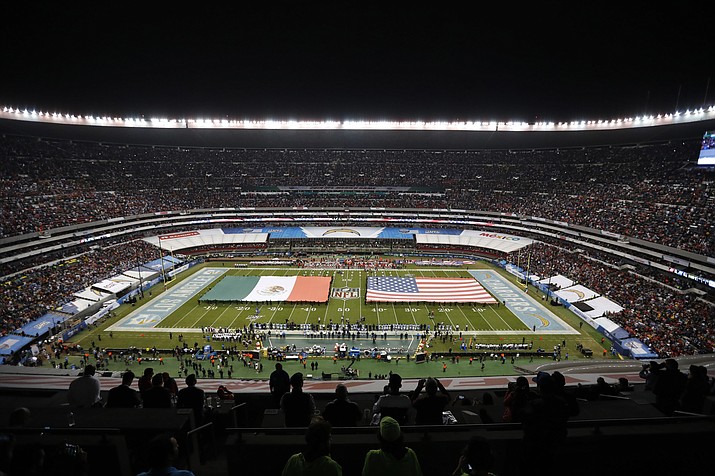 The flags of Mexico and the United States cover the field before a game between the Los Angeles Chargers and the Kansas City Chiefs Monday, Nov. 18, 2019, in Mexico City. The NFL returns to Mexico City on Monday, Nov. 21, 2022, when Arizona Cardinals play the San Francisco 49ers. (Eduardo Verdugo/AP, File)