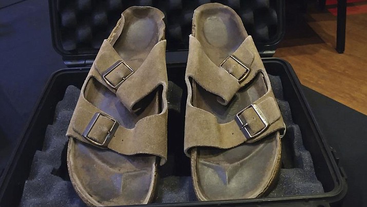 In this photo are Steve Jobs' Birkenstock sandals sold at the Idols & Icons Rock N' Roll auction at the Hard Rock Cafe in New York, Sunday Nov. 13, 2022. The California house where Steve Jobs co-founded Apple is a historical site, and now the sandals he wore while pacing its floors have been sold for nearly $220,000, according to an auction house. (Julien's Auctions via AP)