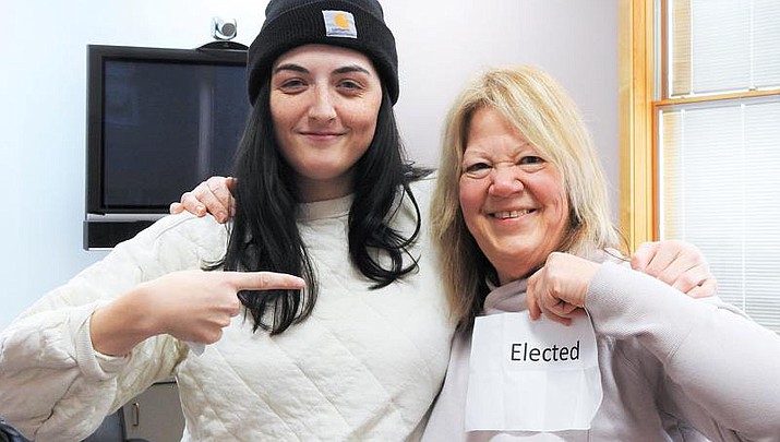 Timeen Adair, right, won a seat on the city council in Rogers City, Mich., after a 616-616 tie with Brittany VanderWall. The election tie was settled Monday, Nov. 14, 2022, when the candidates pulled pieces of paper from a bowl. Adair's said "elected." (Julie Riddle/The Alpena News via AP)
