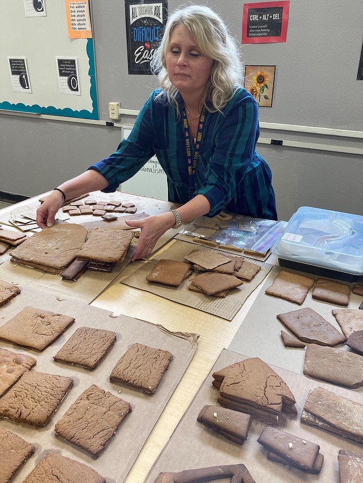 Culinary lab instructor Jaclyn Beilfuss showing off students’ gingerbread to be used to build gingerbread houses and decorations for the Prescott Resort’s 30th annual Gingerbread Village and competition for the holidays. (Nanci Hutson/Courier)