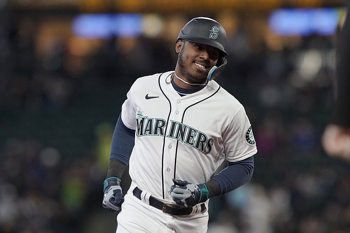 Seattle Mariners' Kyle Lewis runs the bases after he hit a solo home run against the Houston Astros during the second inning of a baseball game May 28, 2022, in Seattle. The Arizona Diamondbacks acquired Lewis from the Mariners on Thursday, Nov. 17, in exchange for catcher/outfielder Cooper Hummel, according to a person with direct knowledge of the deal. The person spoke to The Associated Press on condition of anonymity because the deal has not been officially announced. (Ted S. Warren/AP, File)
