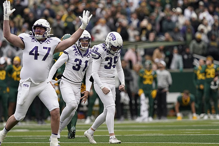 TCU place kicker Griffin Kell (39) celebrates with teammates Jake Boozer (47) and Jordy Sandy (31) after hitting a field goal in the final seconds of an NCAA college football game against Bayor in Waco, Texas, Saturday, Nov. 19, 2022. TCU won 29-28. (LM Otero/AP)