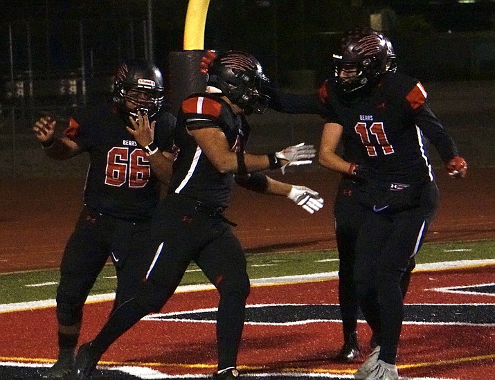 Bradshaw Mountain running back Gabriel Ricketts, middle, celebrates with teammates after he scoring a touchdown in a first-round state playoff game against Northwest Christian on Friday, Nov. 18, 2022, at Bob Pavlich Field in Prescott Valley. (Aaron Valdez/Courier)